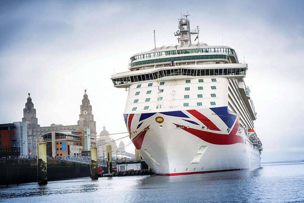Seaport image in Liverpool with a big ship from a cruise line company / popular destinations in the uk